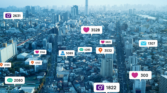 Cityscape from above showing pop-ups of social media users’ activities.
