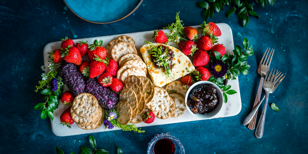 a plate of food with fruit and crackers