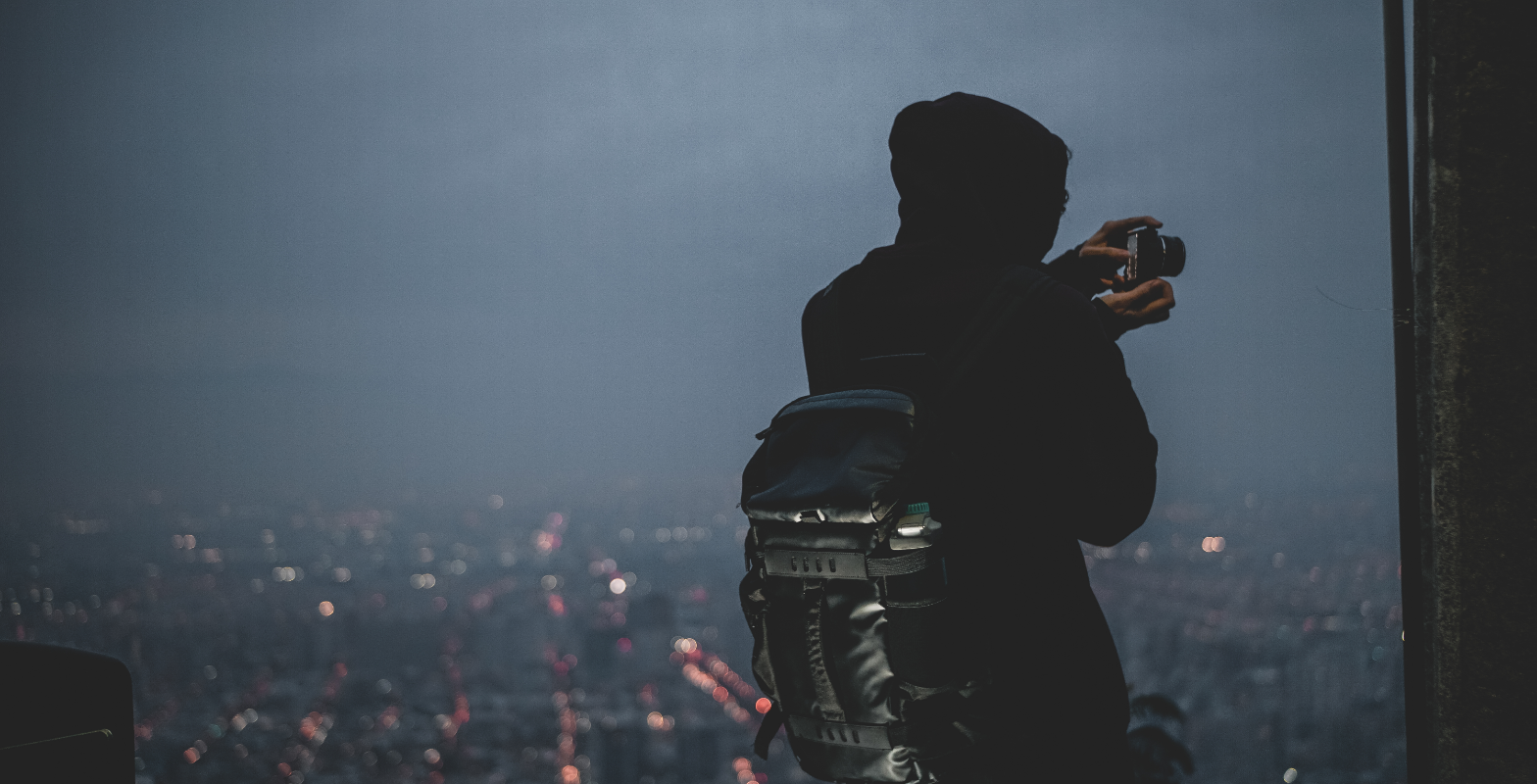pexels-james-macdonald-4049526-1756 | Path Social | Path Social Person taking a nighttime cityscape photo for Instagram.