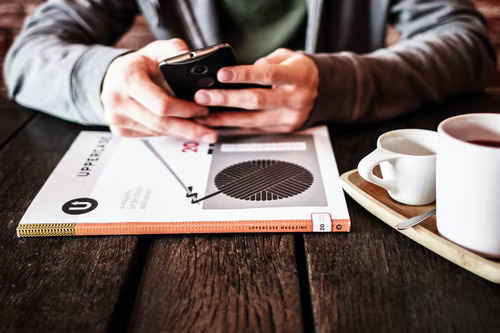 Person checking and deleting Instagram messages on their phone.