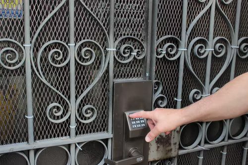 Person keying in access code to demonstrate restricted access on Instagram.