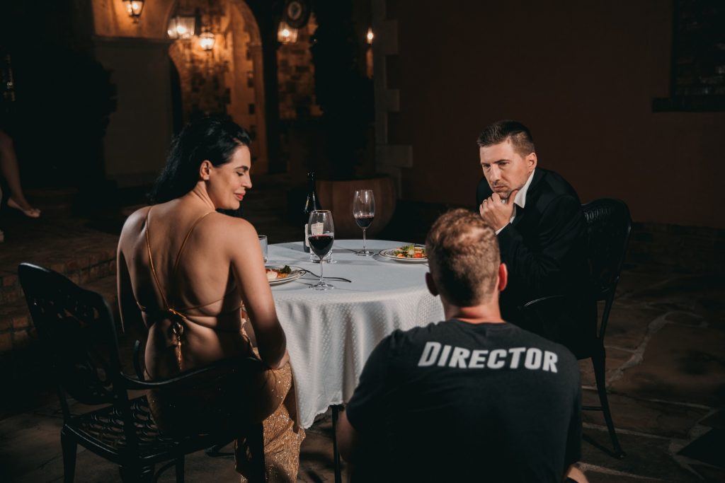 Director giving instructions to two actors to represent conceptualizing for an Instagram takeover event. 