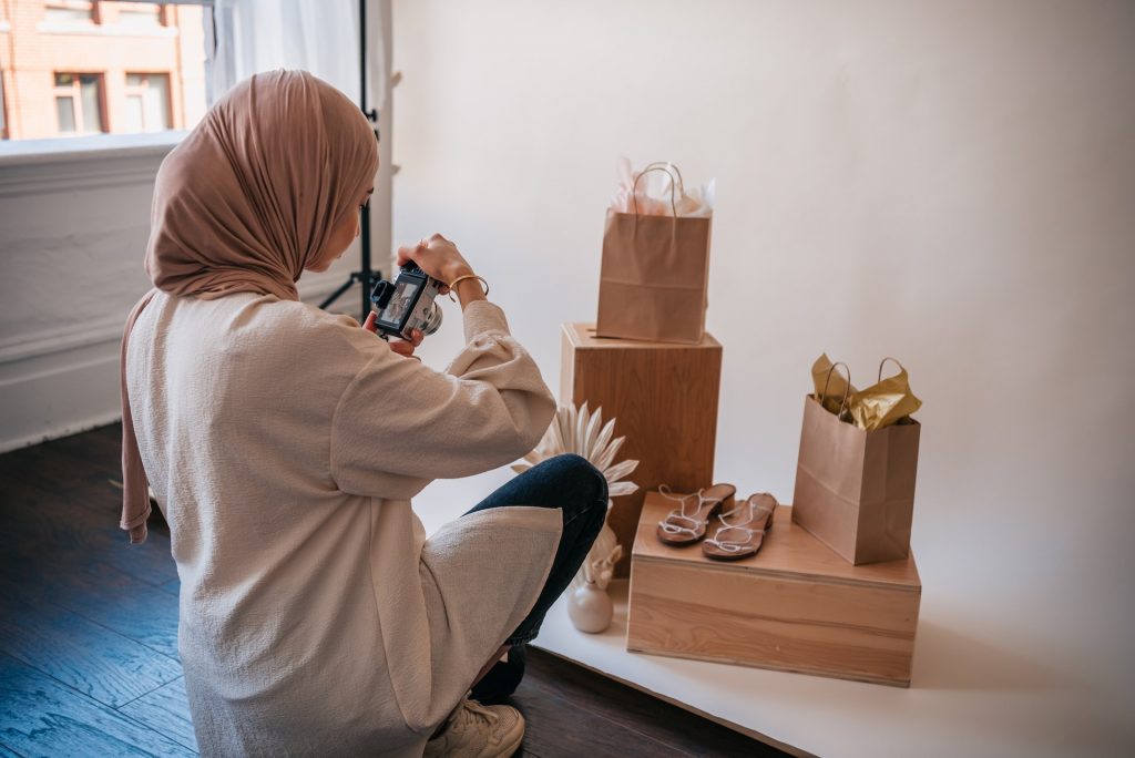 Woman taking photos of products for her Instagram handle.