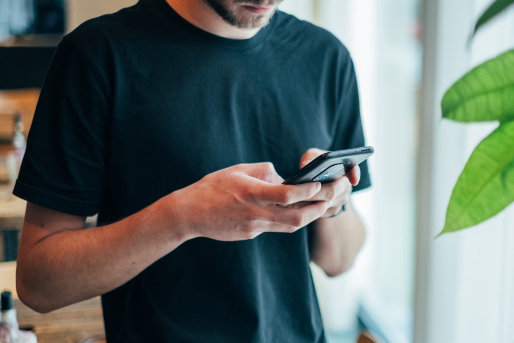 a man holding a cellphone