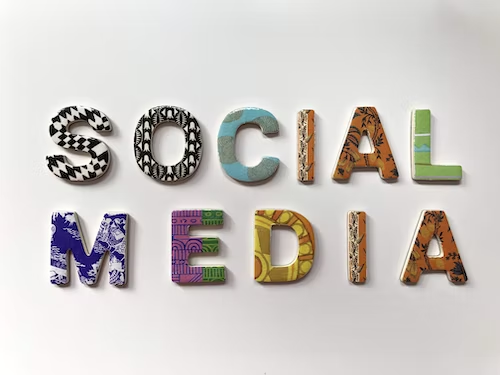 Signage spelling out Social Media in various text designs.