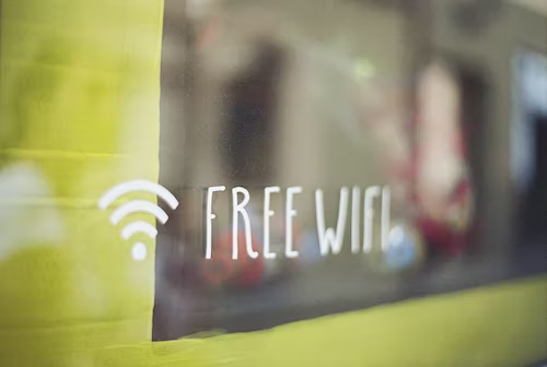 Free WiFi sign painted on a storefront to invite customers and potential new followers. 