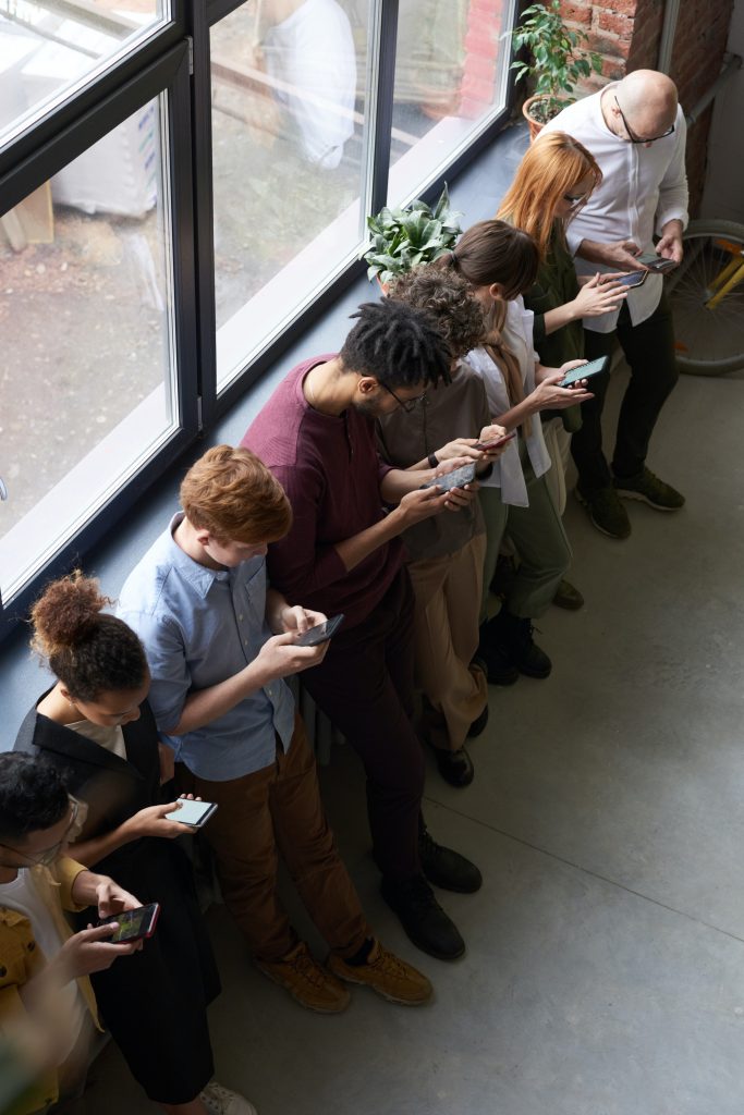 People holding their phones.