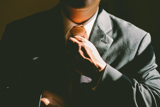 An Instagram entrepreneur tightening his tie