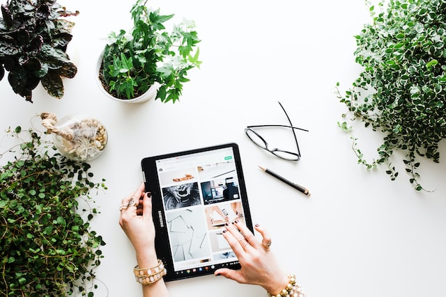 Person working on a tablet for their Instagram product launch. 