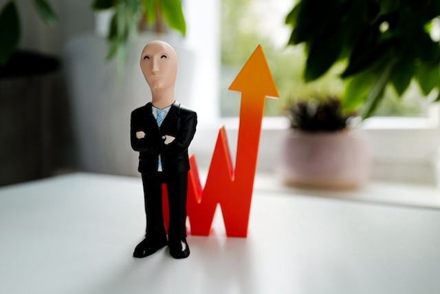 Plastic figure of a man and a spiking arrow indicating fake Instagram growth.
