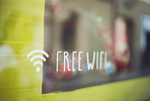 markus-spiske-L-mHnEJXR6A-unsplash | Path Social Free WiFi sign painted on a storefront to invite customers and potential new followers.