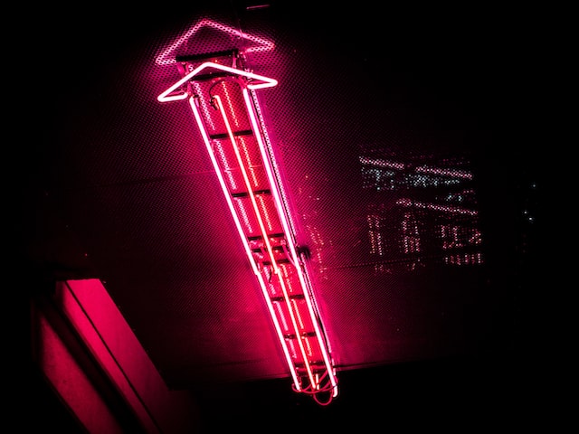 pedroforesterdasilvaFqw7jHFZRZ0unsplash | Path Social Red neon arrow pointing up to represent follower growth from MrInsta