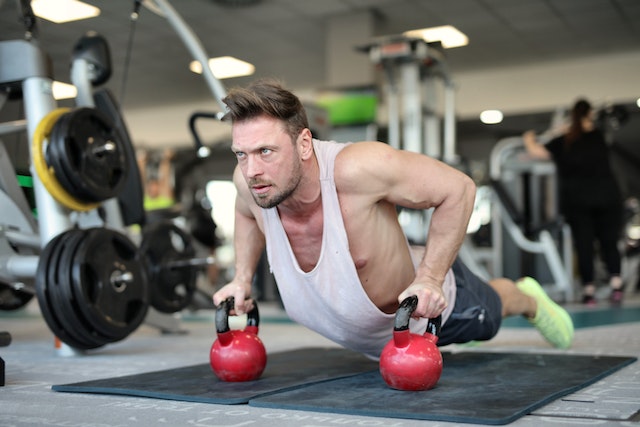 Person filming workout content to learn how to become a fitness influencer.