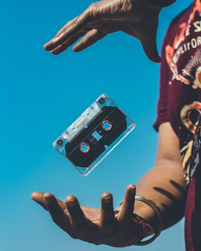  Person throwing a cassette tape.