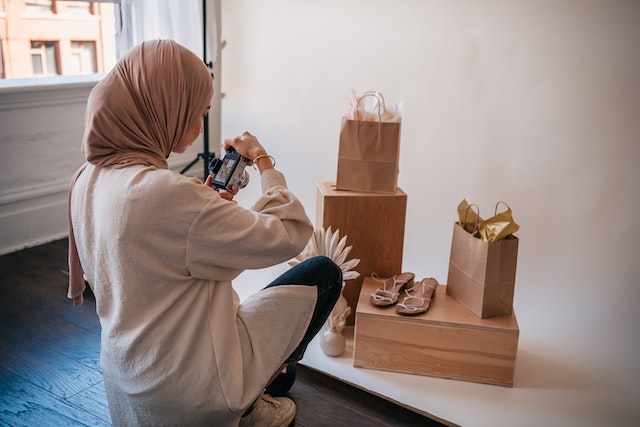 Woman taking photos of products for her Instagram handle.