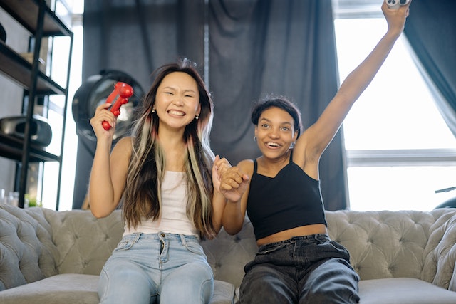 Two friends celebrating after winning an Instagram giveaway.