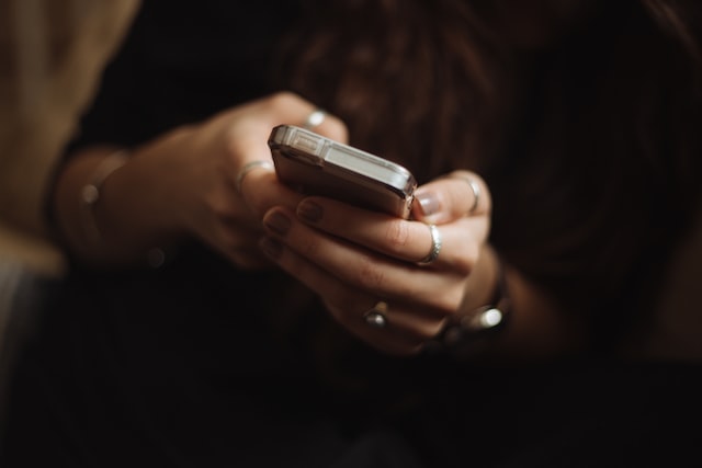 Person typing on a phone to answer an Instagram poll.