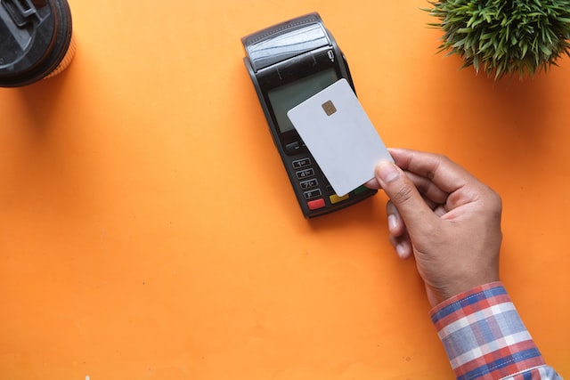towfiqubarbhuiyaHNPrWOH2Z8Uunsplash | Path Social Card being swiped over a machine to make payment for MrInsta purchase