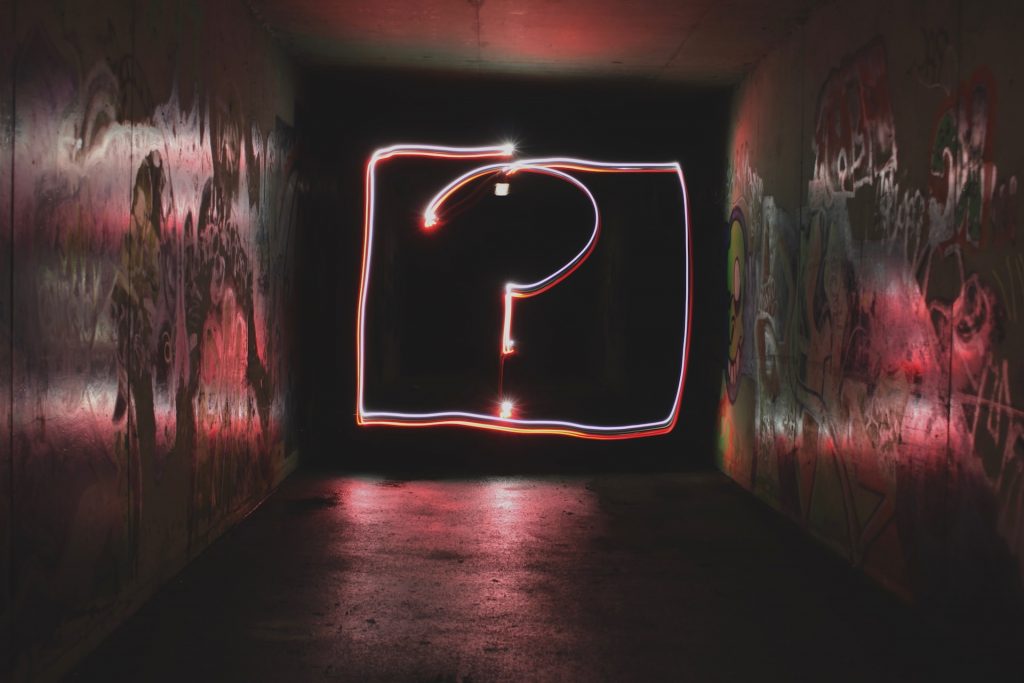  A neon sign in the shape of a question mark. 