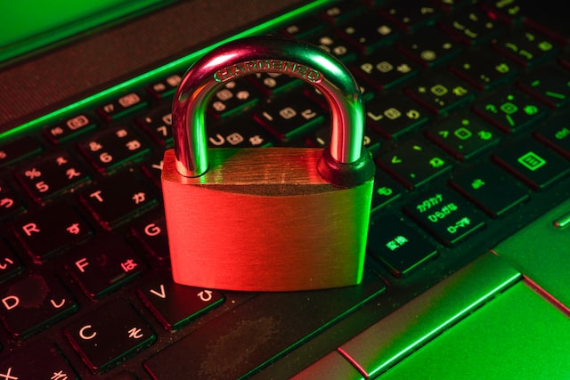 A padlock on top of a laptop.