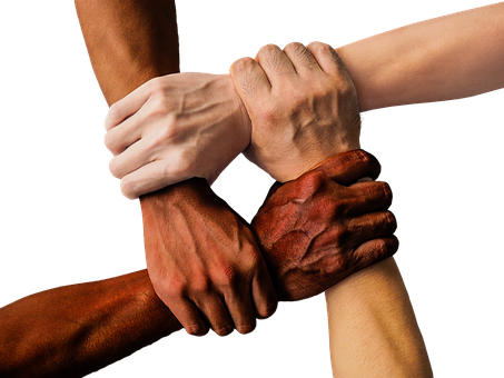 Three people holding each others wrists