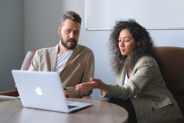 Business partners discussing if the follower package being offered is legit.