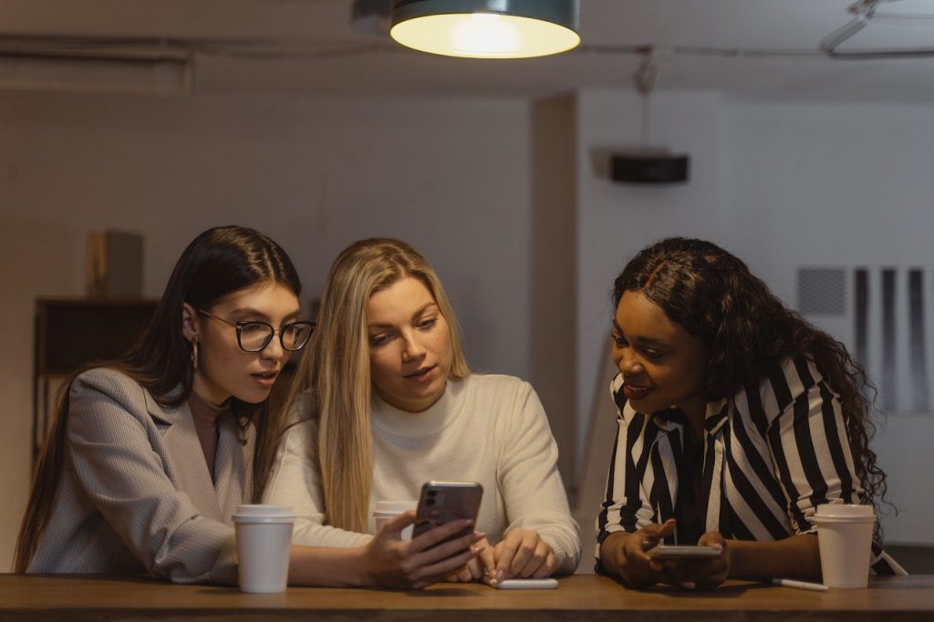 Friends looking up who the most followed person on Twitter is.