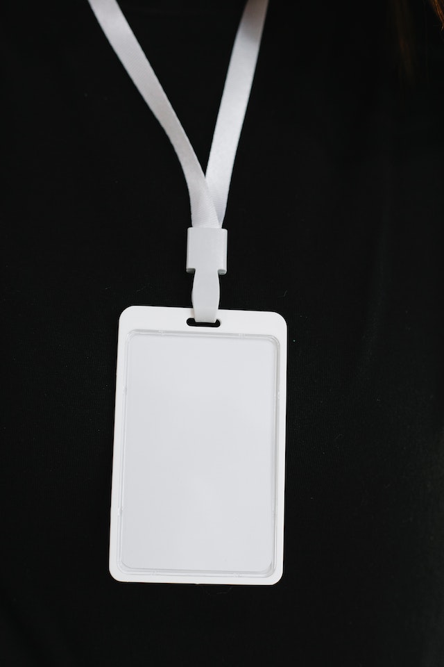 White nametag against a black background.