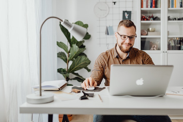 pexelskarolinagrabowska5882683 | Path Social A man researching the question of will IG ban you for buying followers
