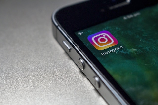 Picture of a smartphone with the Instagram logo on its screen