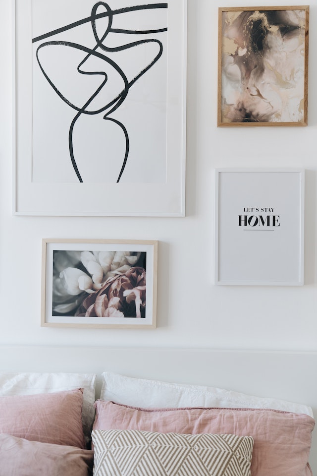 Wooden Framed Pictures Hanging on the White Wall