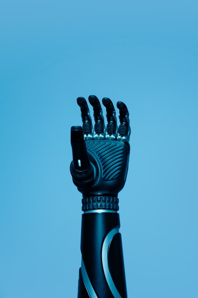 Prosthetic Arm on Blue Background
