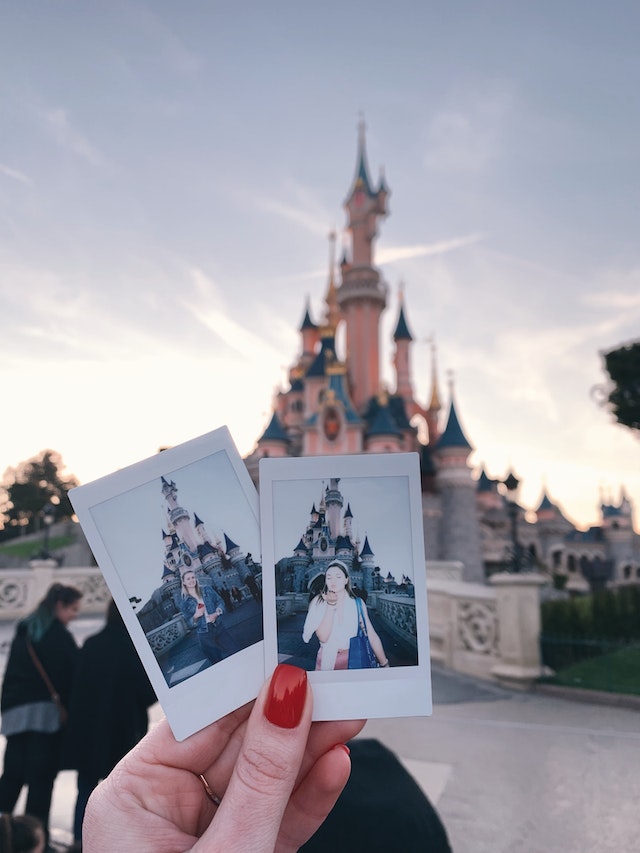 Photo of Person's Hand Holding Instant Picture
