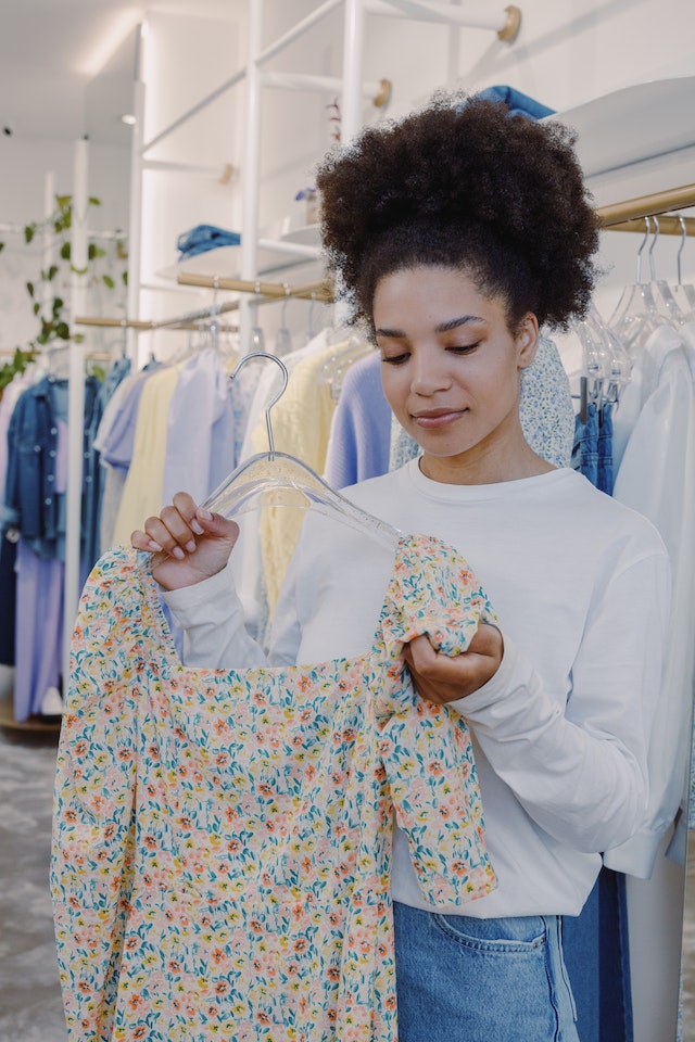 A woman shopping for clothes.