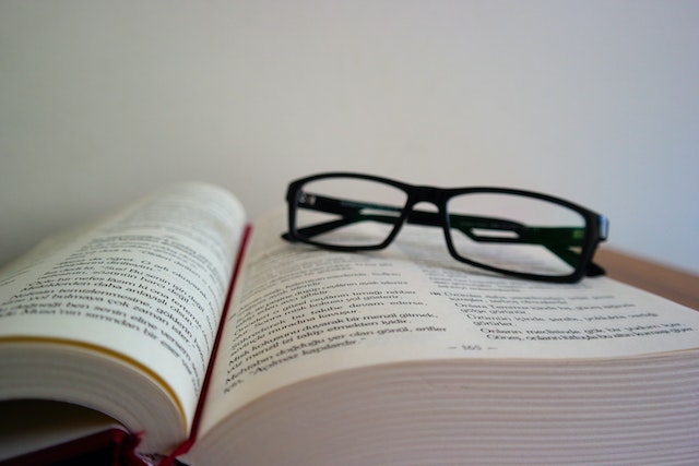 Close-up of Eyeglasses on top of Book
