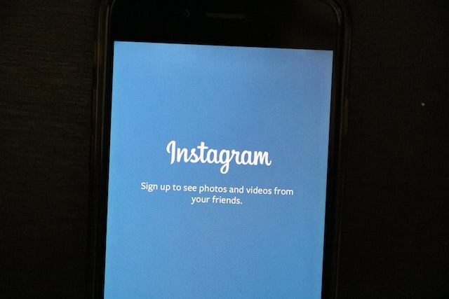 Turned-on smartphone displaying Instagram application loading screen.