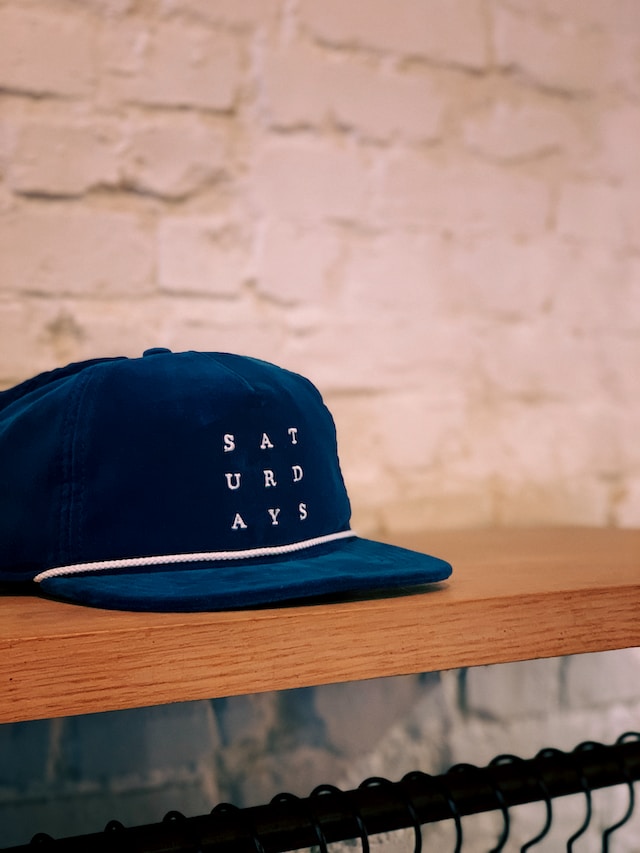 Hat with "Saturdays" embroidery representing scheduling Instagram posts.
