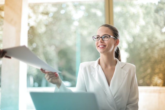 pexels-andrea-piacquadio-3756678 | Path Social Positive businesswoman doing paperwork in her office.