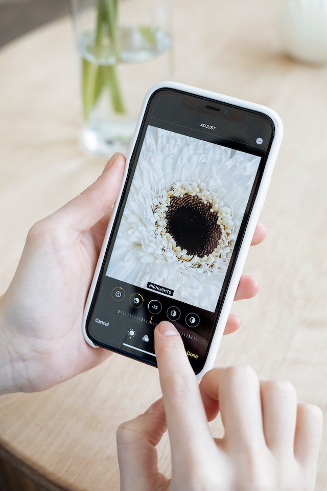 pexels-anna-nekrashevich-7550898 | Path Social A person holding an iPhone editing a picture
