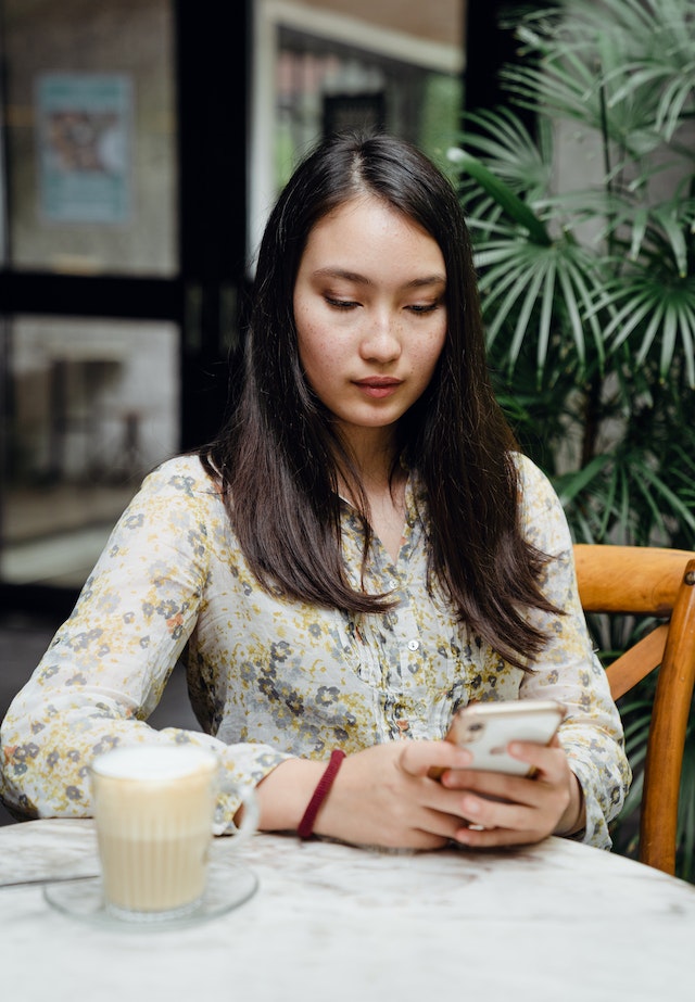 pexels-ketut-subiyanto-4350175 | Path Social Asian woman messaging on mobile phone in a street cafe