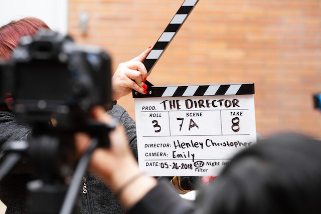 pexels-martin-lopez-1117132 | Path Social Man Holding Clapper Board