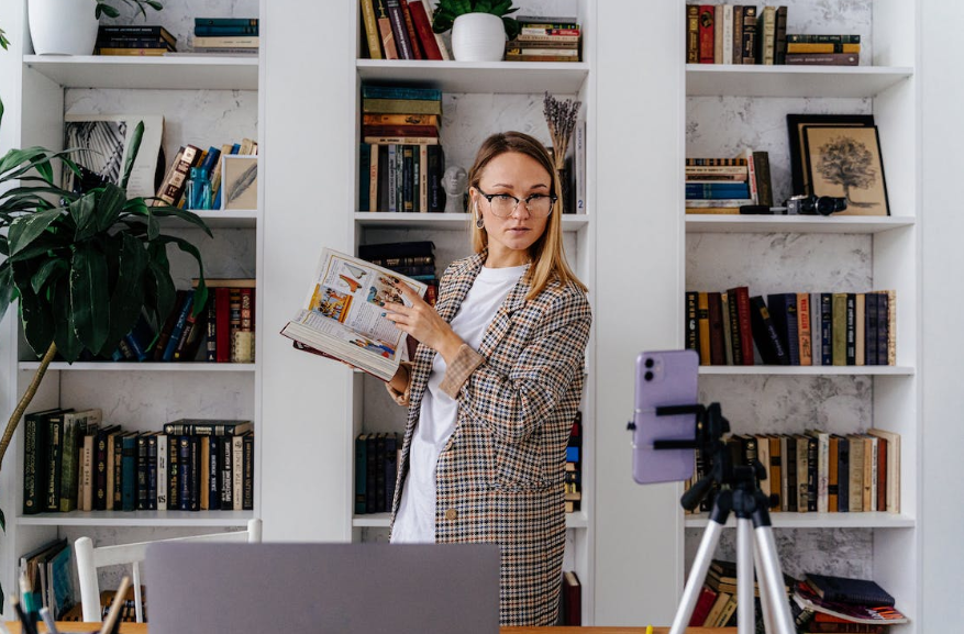 A woman recording a reel for her Instagram account. 