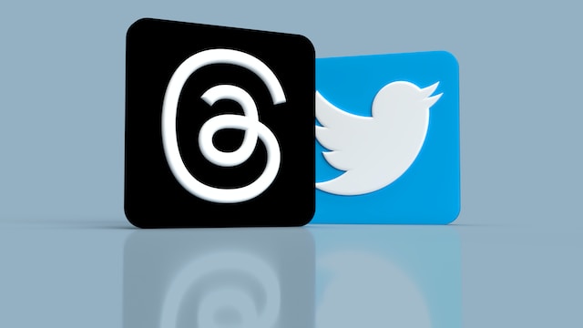 The logos of the Threads app and Twitter.