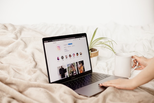 collabstr-AOa7WjjDc8U-unsplash-2 | Path Social A verified account on Instagram displayed on a user’s PC.