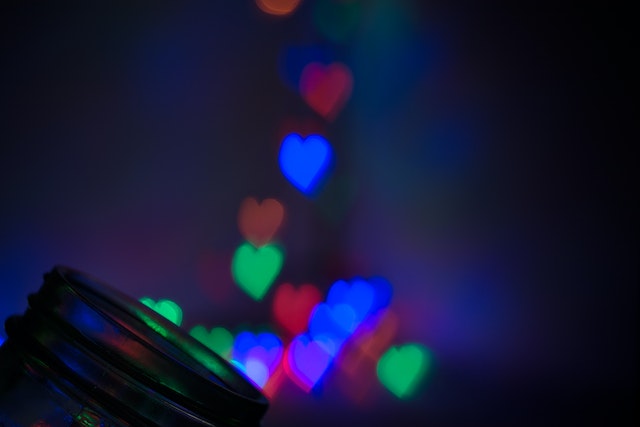 A blurry image of multi-colored hearts.