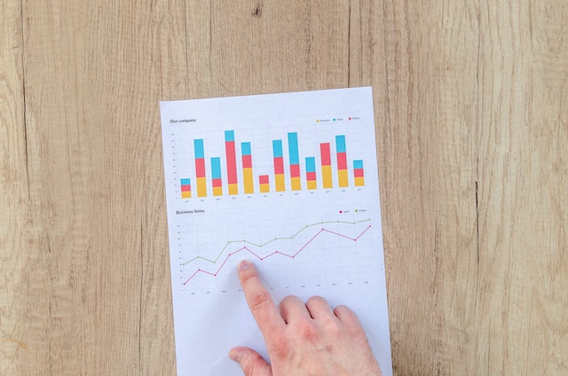 pexels-lukas-590011 | Path Social Statistics on a paper and a person pointing towards it.
