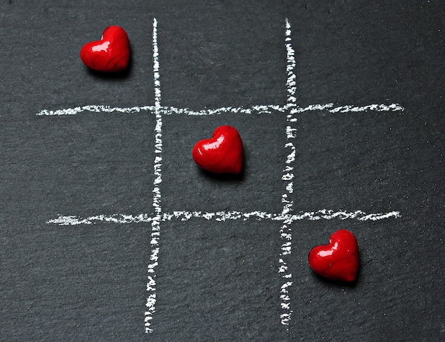 Instagram-like hearts arranged across a tik-tak-toe game.