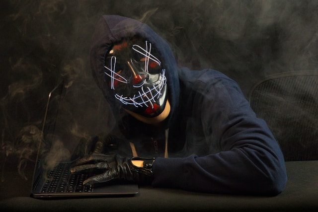 A hacker is wearing a mask.