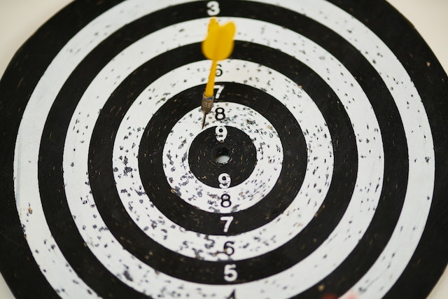 A Black and white dartboard. 