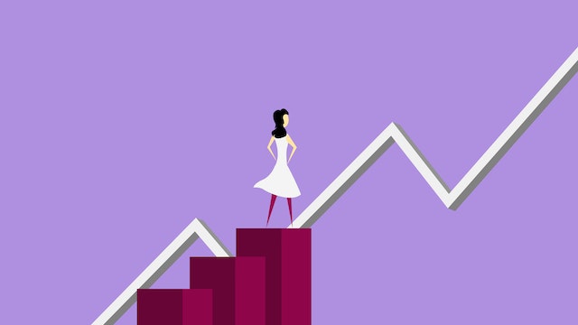A woman standing on a platform staring at a growth chart representing a good Instagram strategy for the social media platform.